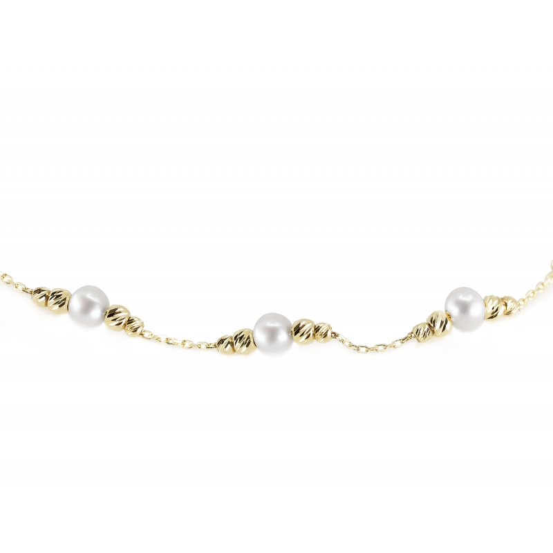 Złota bransoletka z białymi perłami